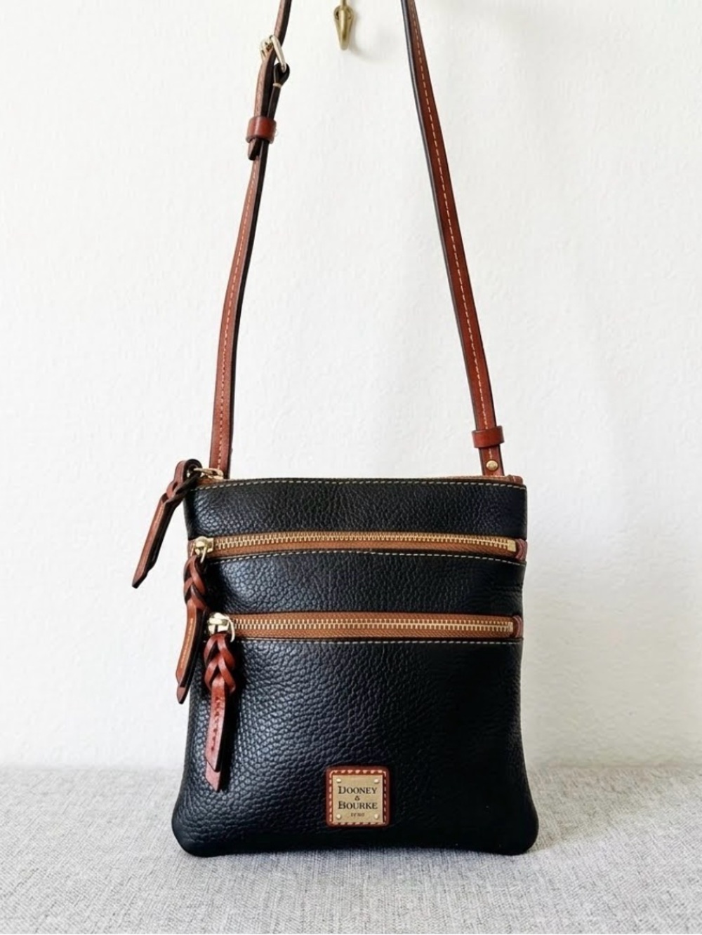 Dooney & Bourke Black Pebble Leather Crossbody with Brown Trim and Braided Pulls